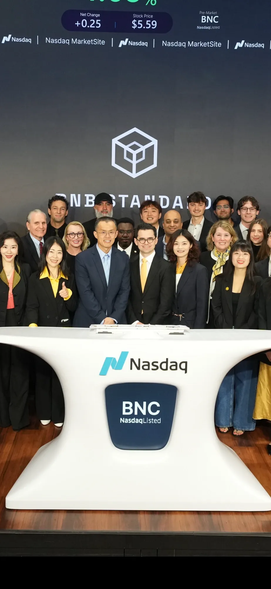 Ryan Myher outside the Nasdaq MarketSite in Times Square at the BNB Standard opening bell event