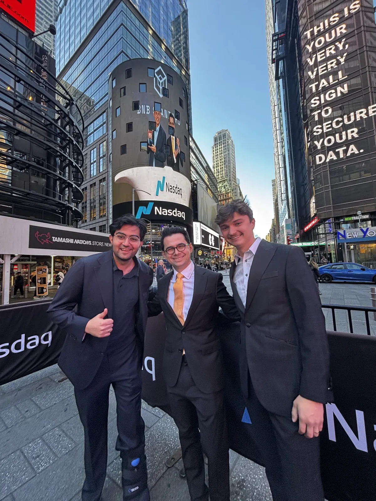 Changpeng Zhao and Alex Odagius ring the Nasdaq opening bell with the BNB Standard team, joined by Ryan Myher